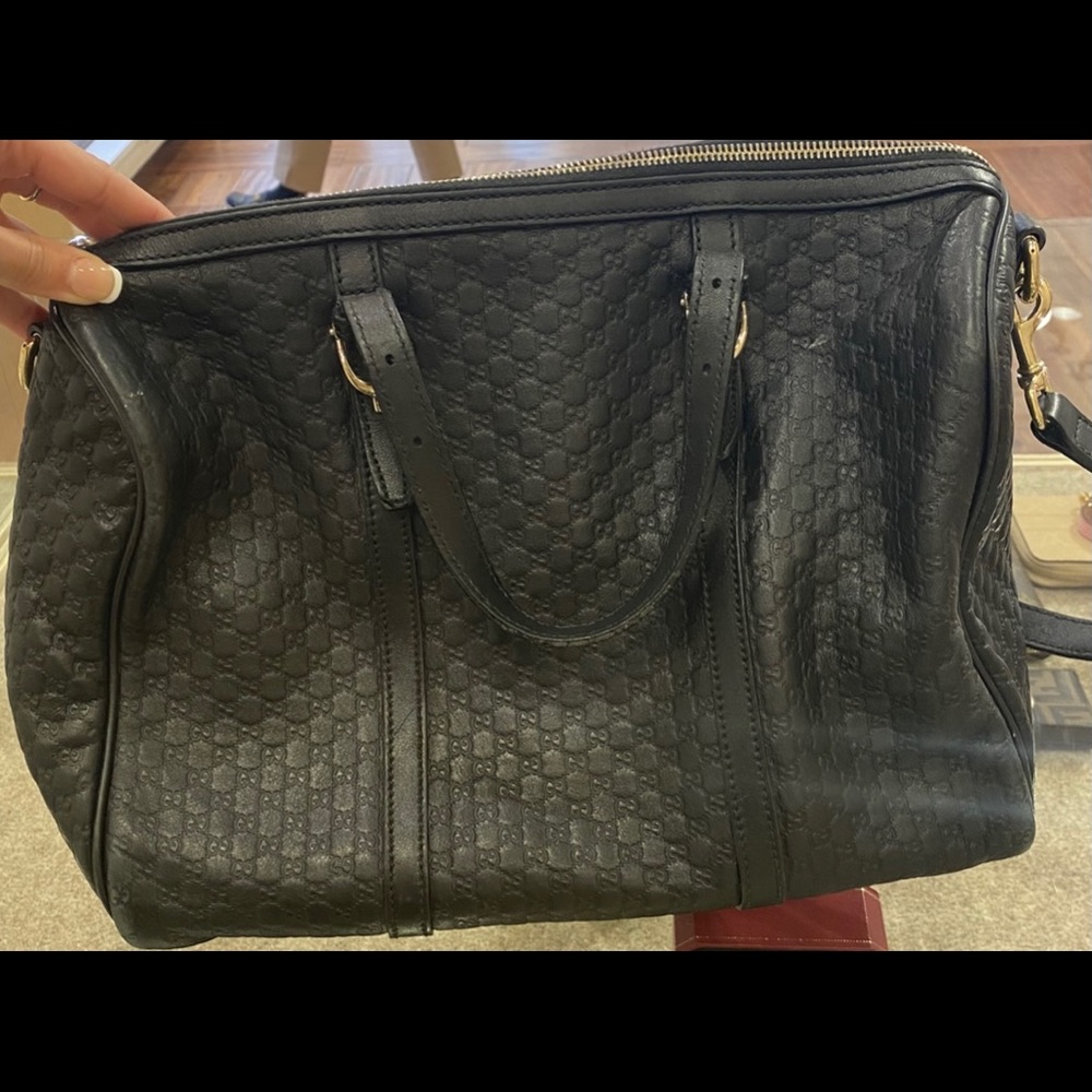 Black Gucci bag, can be worn as cross body. Has slight wear on handles/ corners